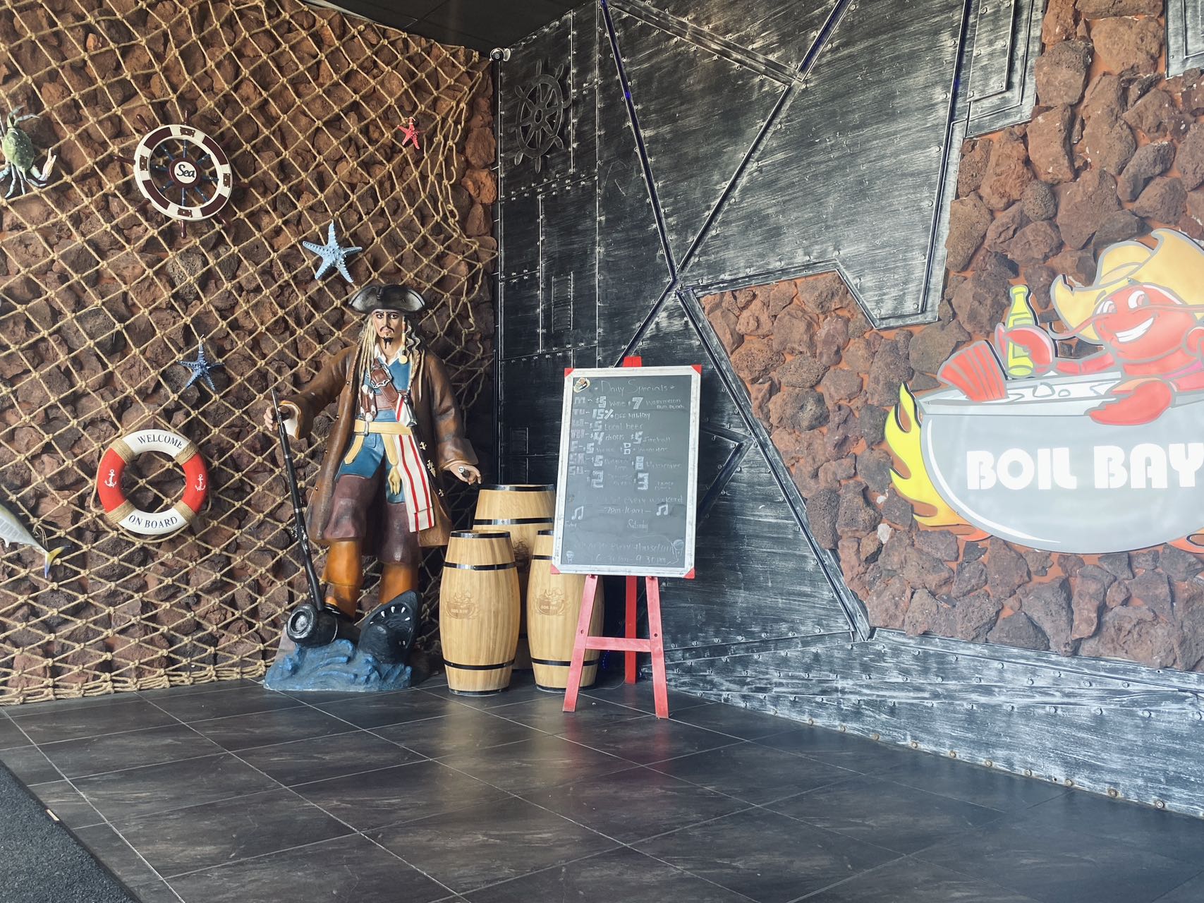 Pirate statue and daily specials chalkboard in the Boil Bay entrance